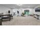 Spacious finished basement with carpeting, work space, and media area at 312 Wichita Way, Mcdonough, GA 30253