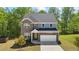 Charming two-story home with a well-manicured lawn and inviting curb appeal at 312 Wichita Way, Mcdonough, GA 30253