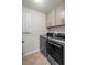 Laundry room with modern front load washer and dryer and ample cabinet space at 312 Wichita Way, Mcdonough, GA 30253