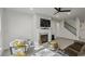 Cozy living room features a fireplace, ceiling fan, and comfortable seating area at 312 Wichita Way, Mcdonough, GA 30253