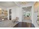 Bright and airy living space showcasing neutral walls, carpet, hardwood floors, a stylish bookshelf, and modern lighting at 312 Wichita Way, Mcdonough, GA 30253