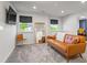 Upstairs living room featuring a comfortable couch, and a mounted television at 312 Wichita Way, Mcdonough, GA 30253