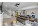 Open-concept living room with a kitchen, dining area, and comfortable seating at 312 Wichita Way, Mcdonough, GA 30253