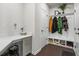 Well-organized mudroom with coat hooks, bench seating, a desk area, and ample storage for shoes and accessories at 312 Wichita Way, Mcdonough, GA 30253