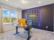 Home office features accent wall, modern desk, and large window at 312 Wichita Way, Mcdonough, GA 30253