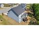 Rear view of a light blue two-story home with a backyard and privacy fence at 312 Wichita Way, Mcdonough, GA 30253