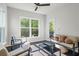 Relaxing sun room with large windows, stylish furniture, and natural light at 312 Wichita Way, Mcdonough, GA 30253