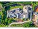 Captivating aerial perspective showcasing the home's unique roofline and expertly designed landscaping at 5004 Gunnison Trce, Suwanee, GA 30024