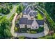 Beautiful home with circular driveway and manicured landscaping at 5004 Gunnison Trce, Suwanee, GA 30024