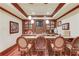 Entertainment bar area with comfortable seating and custom cabinetry, perfect for hosting guests at 5004 Gunnison Trce, Suwanee, GA 30024