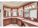 Lavish bathroom with double vanity, custom wood cabinetry, and luxurious fixtures at 5004 Gunnison Trce, Suwanee, GA 30024