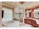 Elegant bathroom featuring a jetted tub, glass-enclosed shower, and luxurious fixtures at 5004 Gunnison Trce, Suwanee, GA 30024