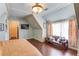 Bedroom with unique ceilings and window, features a seating bench and hardwood floors at 5004 Gunnison Trce, Suwanee, GA 30024