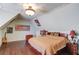 Bedroom showcasing a bed, unique wood floors, and several decorations at 5004 Gunnison Trce, Suwanee, GA 30024