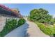 Winding driveway leading to an elegant home with lush landscaping at 5004 Gunnison Trce, Suwanee, GA 30024