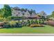 Stately home with manicured landscaping and multiple gables at 5004 Gunnison Trce, Suwanee, GA 30024