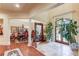 Home foyer featuring hardwood and tile floors, elegant furniture and decor at 5004 Gunnison Trce, Suwanee, GA 30024