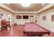 Game room featuring pool table, recessed lighting, and access to additional entertainment spaces at 5004 Gunnison Trce, Suwanee, GA 30024