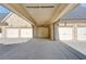 Spacious four car garage of home featuring stone facade and ample parking on concrete driveway at 5004 Gunnison Trce, Suwanee, GA 30024