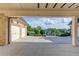 Covered parking area offering a view of a landscaped property at 5004 Gunnison Trce, Suwanee, GA 30024