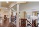 Second floor hallway with wrought iron railing and a chandelier at 5004 Gunnison Trce, Suwanee, GA 30024