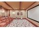 Home theater featuring tiered seating, projector and screen for an immersive movie experience at 5004 Gunnison Trce, Suwanee, GA 30024