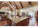 Gourmet kitchen features a large central island, custom cabinetry and an open-concept design at 5004 Gunnison Trce, Suwanee, GA 30024