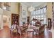 Bright, open living area with soaring ceilings, hardwood floors, custom fireplace and built-in shelves at 5004 Gunnison Trce, Suwanee, GA 30024