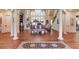 Spacious living room with hardwood floors, high ceilings, and large windows at 5004 Gunnison Trce, Suwanee, GA 30024
