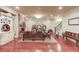 Spacious living room showcasing a stone fireplace, custom display cabinets, and beautiful wood floors at 5004 Gunnison Trce, Suwanee, GA 30024