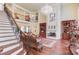 Grand living room with soaring ceilings and ornate chandelier at 5004 Gunnison Trce, Suwanee, GA 30024
