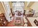 Bright living room featuring hardwood floors, a fireplace and tall windows at 5004 Gunnison Trce, Suwanee, GA 30024