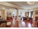 Open living room area featuring hardwood floors, modern decor, and abundant natural light at 5004 Gunnison Trce, Suwanee, GA 30024