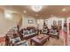 Living room showcasing nice seating arrangements and a bookshelf at 5004 Gunnison Trce, Suwanee, GA 30024