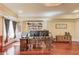Office space featuring built-in shelving, a desk, and hardwood floors at 5004 Gunnison Trce, Suwanee, GA 30024