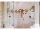 Beautifully designed shower with custom tile, glass enclosure, and modern fixtures at 5004 Gunnison Trce, Suwanee, GA 30024