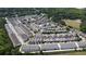 Aerial view of a neighborhood with well-maintained homes and green spaces at 690 Stickley Oak Way, Woodstock, GA 30189