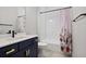 Clean bathroom with white tile, modern vanity, and shower-tub combination at 690 Stickley Oak Way, Woodstock, GA 30189