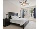 Spacious bedroom with large windows, dark trim, and comfortable furniture at 690 Stickley Oak Way, Woodstock, GA 30189