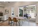 Bright dining area with modern table and chairs, sliding door to outdoor patio at 690 Stickley Oak Way, Woodstock, GA 30189