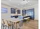 Modern kitchen with a large island, stainless steel appliances, and an attached dining area at 690 Stickley Oak Way, Woodstock, GA 30189