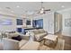 Open-concept living and kitchen area with hardwood floors and plenty of natural light at 690 Stickley Oak Way, Woodstock, GA 30189