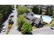 Aerial view of the community pool and amenity center shows a welcoming space to gather and relax in a well-maintained environment at 690 Stickley Oak Way, Woodstock, GA 30189