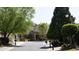 Street view of neighborhood featuring attractive homes with mature trees at 690 Stickley Oak Way, Woodstock, GA 30189