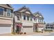 Charming new construction townhomes with brick and siding exterior details at 690 Stickley Oak Way, Woodstock, GA 30189