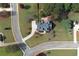 Overhead view shows property's layout within a well-maintained community with landscaped lawns and tree-lined streets at 200 Suffolk Way, Mcdonough, GA 30252