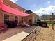 The patio with comfortable seating, grill, and hot tub offers a serene space to relax in the backyard at 200 Suffolk Way, Mcdonough, GA 30252