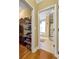 Ensuite bathroom with a walk-in shower, large bathtub, tile floors, and a spacious walk-in closet at 200 Suffolk Way, Mcdonough, GA 30252