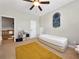 Neutral bedroom with twin bed, colorful storage cubes, adjacent to open upstairs hallway at 200 Suffolk Way, Mcdonough, GA 30252