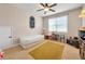 Bright bedroom featuring neutral walls, a twin bed, and decorative accessories creating a warm ambiance at 200 Suffolk Way, Mcdonough, GA 30252